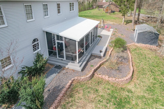 394 W Evergreen Plz, Santa Claus, IN 47579 - rear view of house with a sunroom and a yard