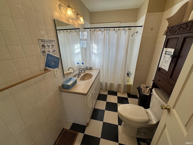 full bathroom with vanity, toilet, shower / bathtub combination with curtain, and tile walls