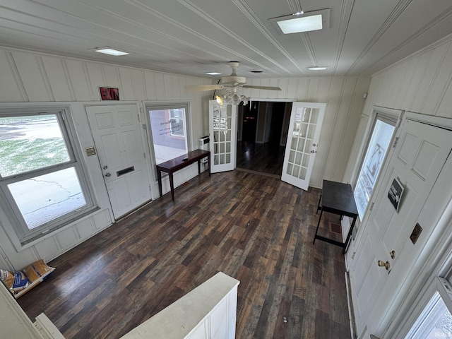 foyer entrance with ceiling fan, plenty of natural light, dark wood-type flooring, and french doors