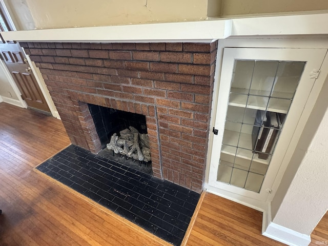 interior details with a fireplace and hardwood / wood-style floors