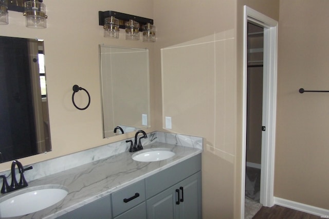 bathroom featuring vanity and hardwood / wood-style flooring