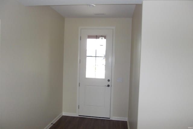 doorway featuring dark hardwood / wood-style floors