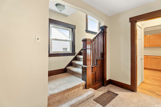 stairs featuring wood-type flooring