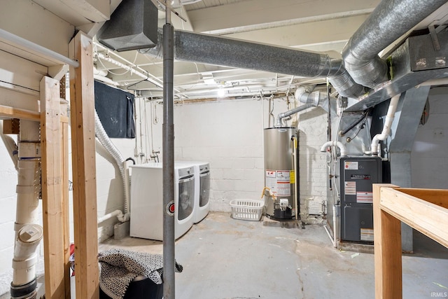 basement with washing machine and dryer and gas water heater