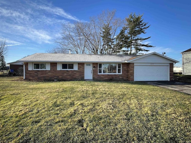 single story home with a garage and a front lawn