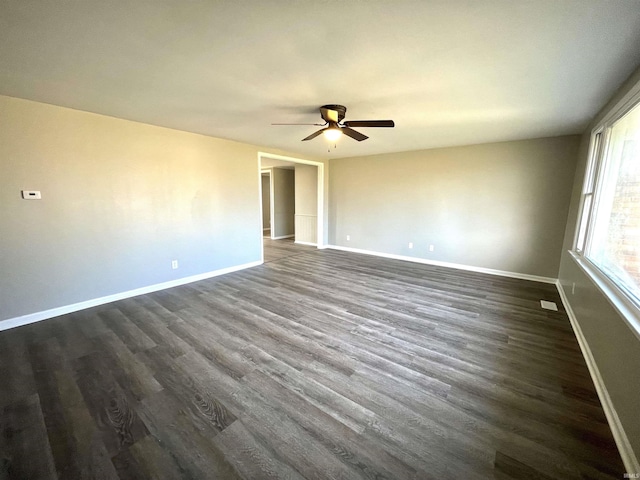 unfurnished room with dark hardwood / wood-style floors and ceiling fan