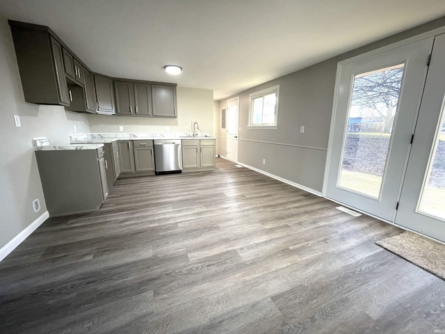 kitchen featuring gray cabinets, dishwasher, light hardwood / wood-style floors, and sink