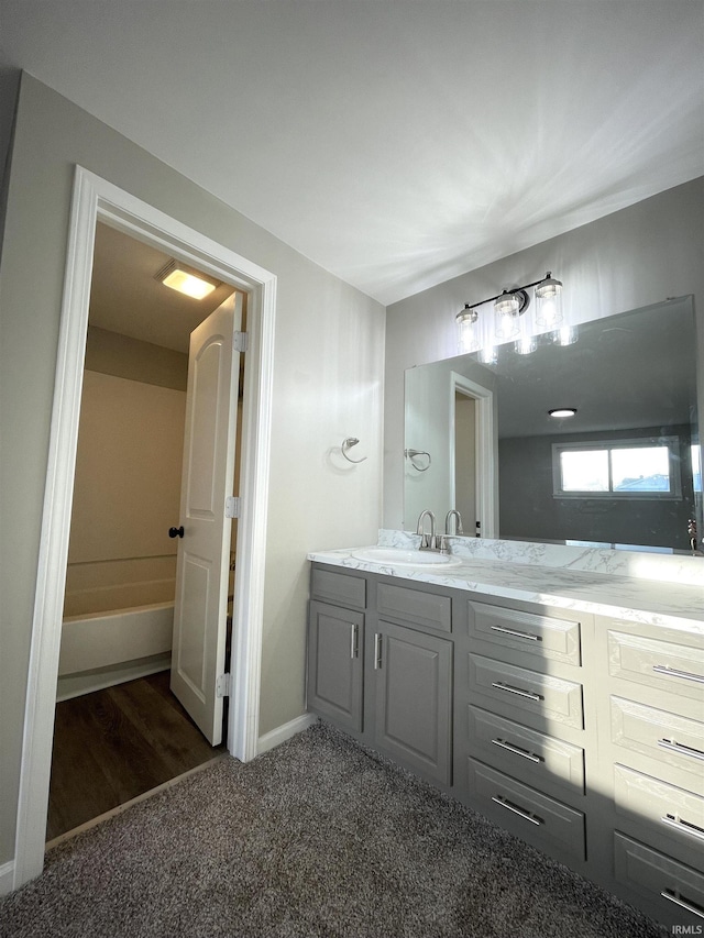 bathroom with vanity and wood-type flooring