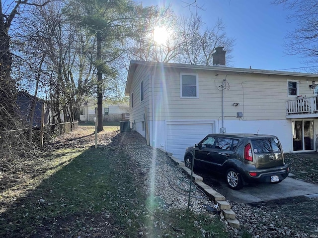 back of property featuring a garage