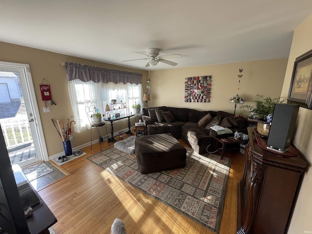 living room featuring hardwood / wood-style flooring and ceiling fan