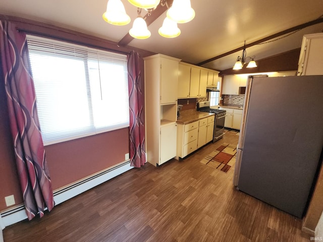 kitchen featuring white cabinets, stainless steel appliances, dark wood-type flooring, decorative light fixtures, and a chandelier