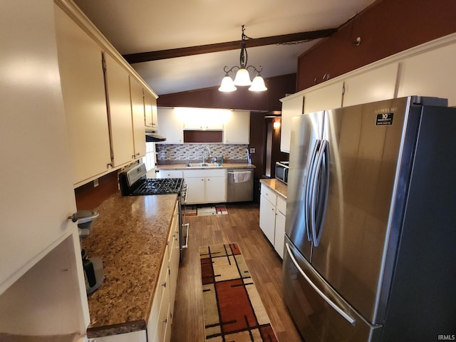 kitchen with backsplash, an inviting chandelier, decorative light fixtures, white cabinetry, and stainless steel appliances