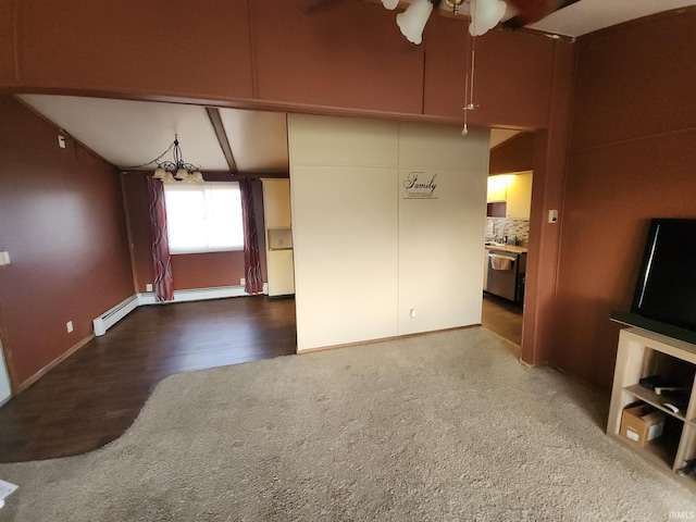 unfurnished living room with hardwood / wood-style floors, lofted ceiling with beams, baseboard heating, and ceiling fan with notable chandelier