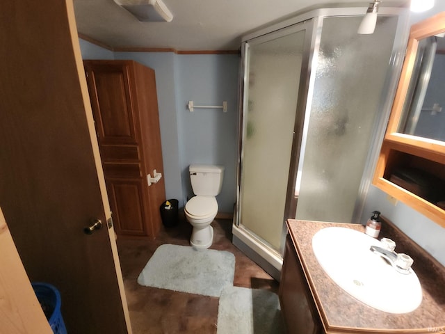 bathroom featuring vanity, toilet, ornamental molding, and walk in shower