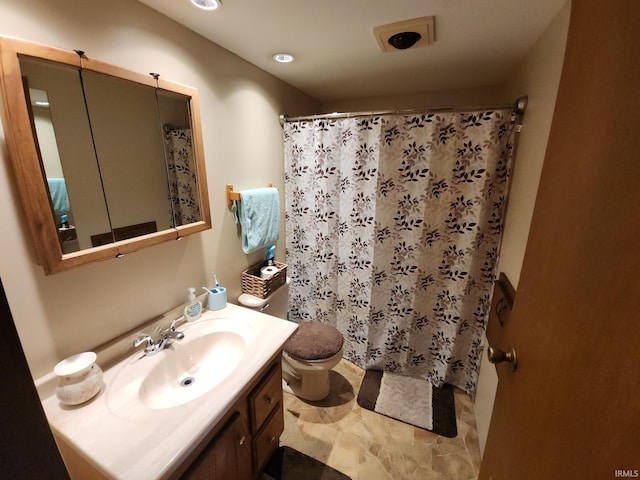 bathroom with vanity and toilet