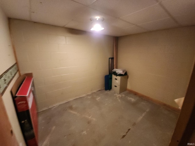 basement featuring a drop ceiling