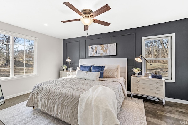 bedroom featuring dark hardwood / wood-style floors and ceiling fan