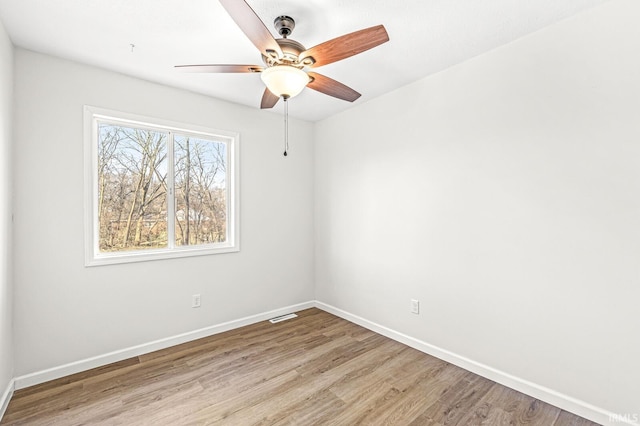 spare room featuring ceiling fan and light wood-type flooring