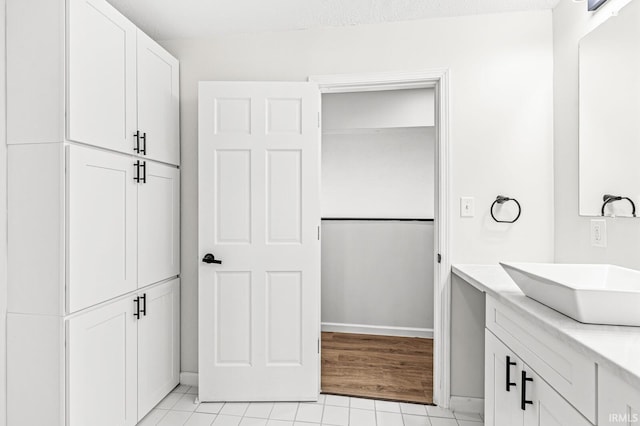 bathroom featuring vanity and hardwood / wood-style flooring