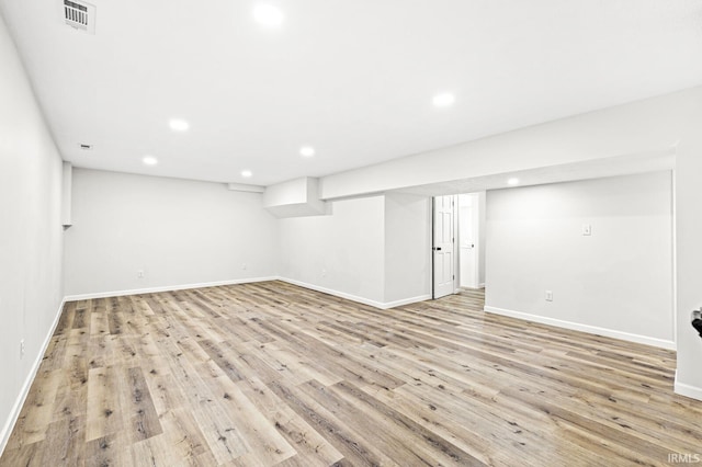 basement featuring light hardwood / wood-style floors