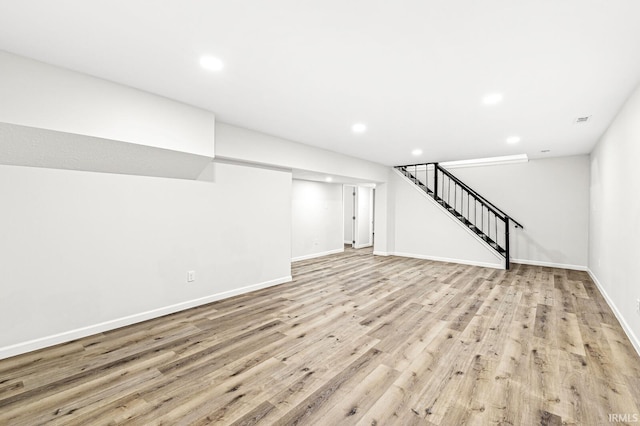 basement with light wood-type flooring