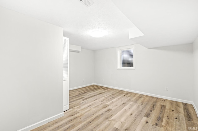 basement featuring light hardwood / wood-style floors