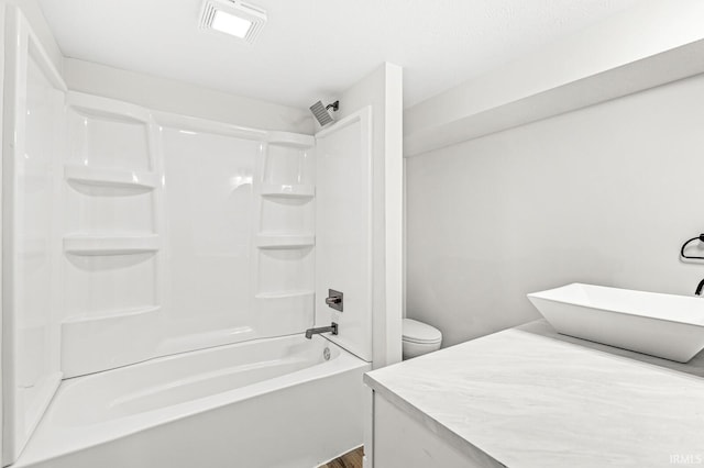 full bathroom featuring vanity, shower / bathing tub combination, and toilet