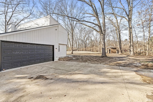 view of side of home with an outbuilding and a garage