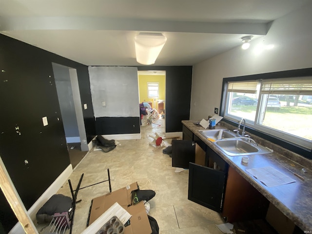 kitchen with sink and light tile patterned floors