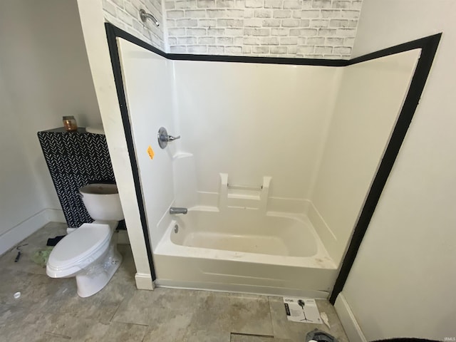 bathroom with shower / tub combination and toilet