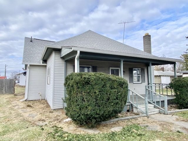 back of house featuring covered porch