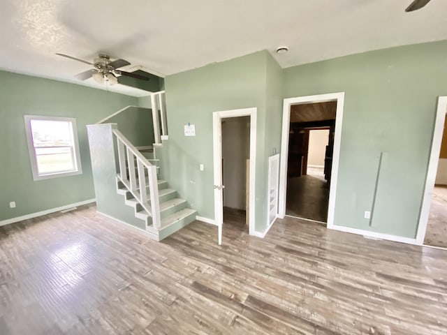 spare room featuring light hardwood / wood-style floors and ceiling fan