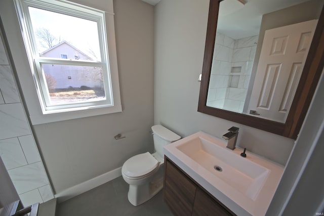 bathroom with tile patterned floors, vanity, and toilet