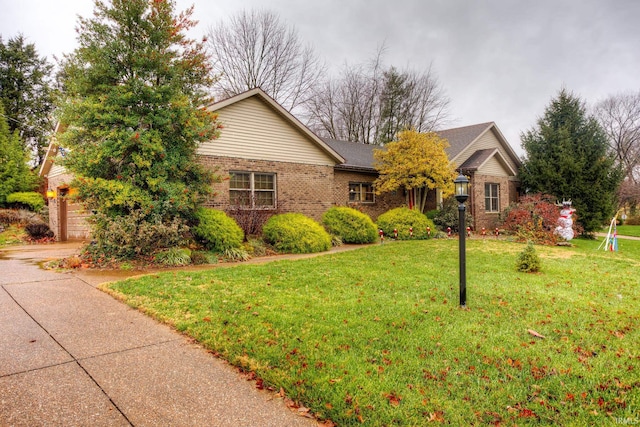 ranch-style house with a front lawn and a garage