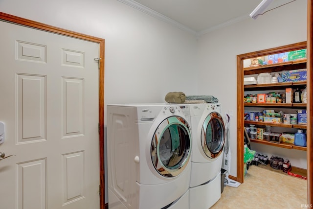 laundry room featuring washer and dryer and ornamental molding