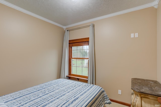 bedroom featuring ornamental molding and a textured ceiling