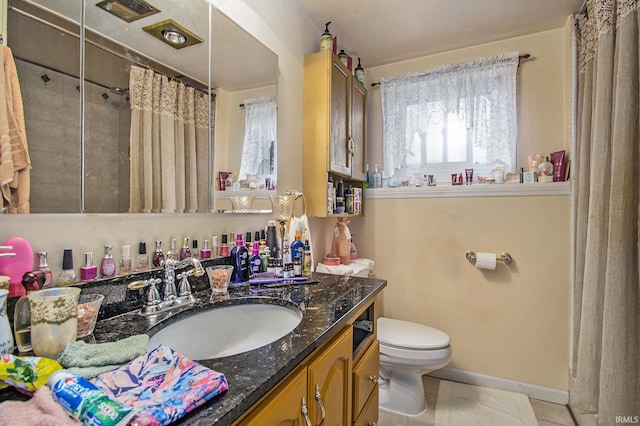 bathroom featuring tile patterned floors, vanity, toilet, and a shower with shower curtain