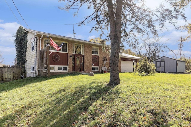 rear view of house featuring a garage and a lawn