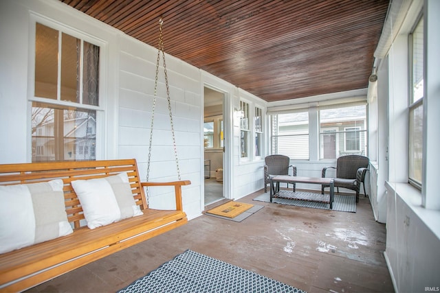 sunroom featuring wooden ceiling