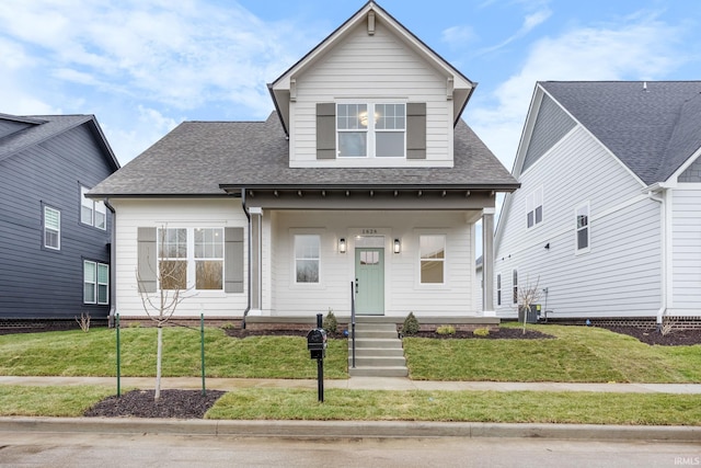 view of front facade with a porch and a front lawn