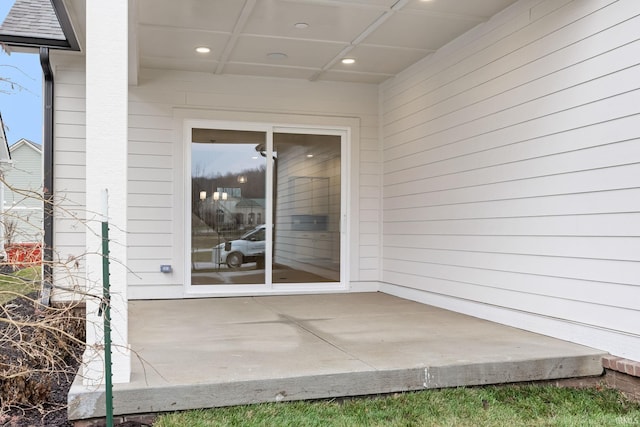 property entrance with a patio area