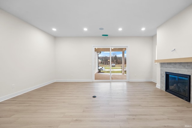 unfurnished living room with light hardwood / wood-style flooring