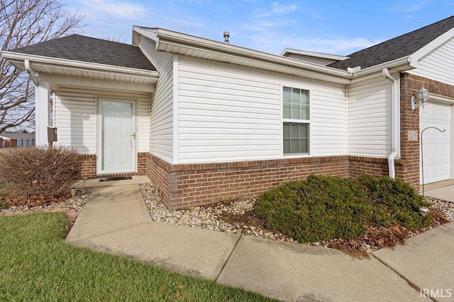 entrance to property featuring a garage