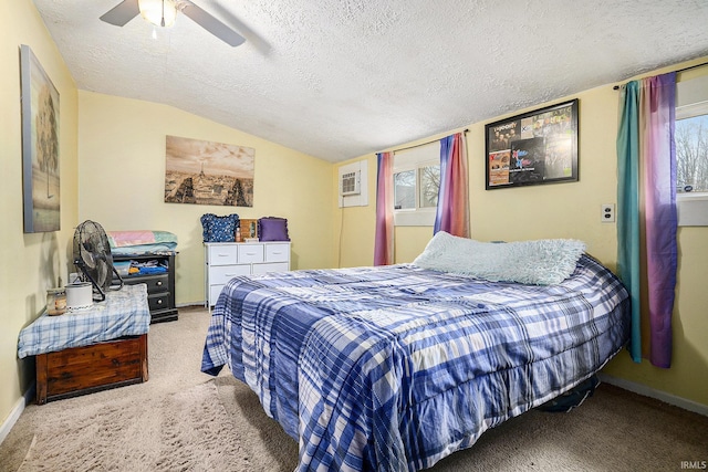 bedroom with multiple windows, a textured ceiling, vaulted ceiling, and ceiling fan