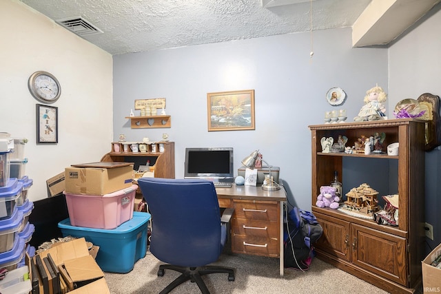 office space with carpet flooring and a textured ceiling