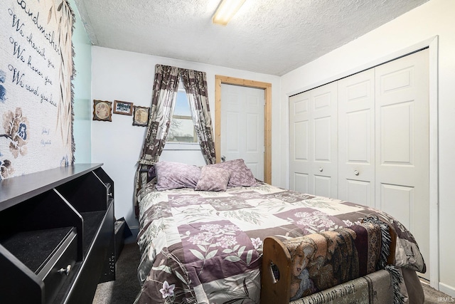 carpeted bedroom with a textured ceiling, a closet, and ceiling fan