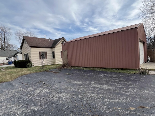 view of side of property featuring an outbuilding