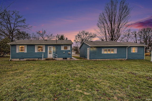 single story home featuring a yard