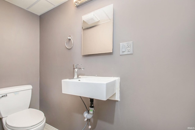 bathroom with toilet and sink