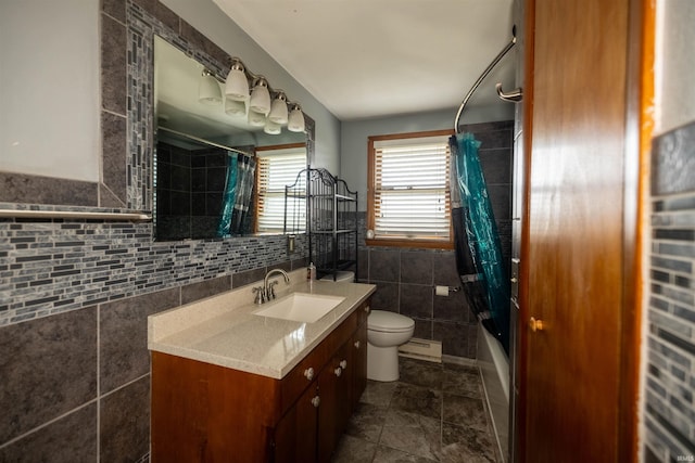 full bathroom with toilet, vanity, shower / tub combo with curtain, and tile walls